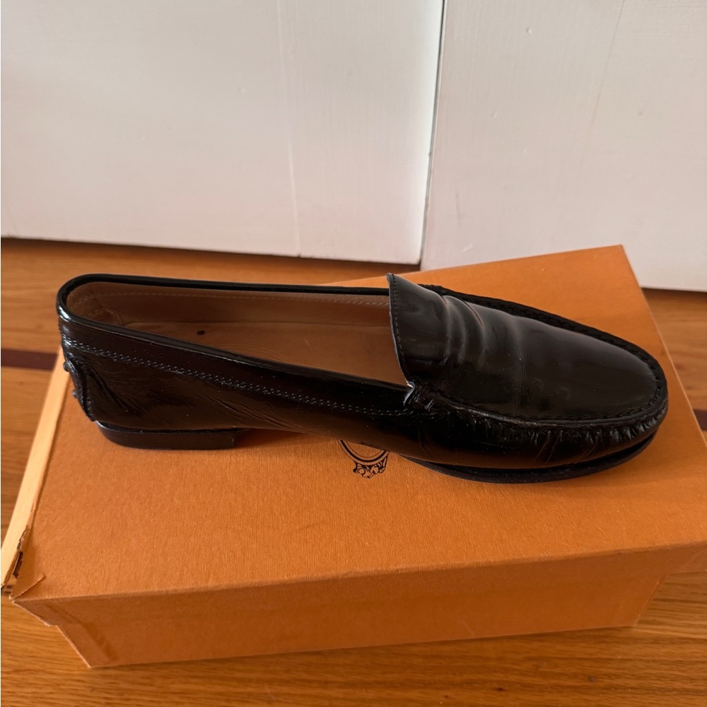 Classic Black Tod’s Patent Leather Penny Loafers